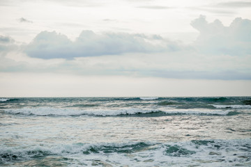 Naklejka na ściany i meble horizon of the sea with clouds and waves