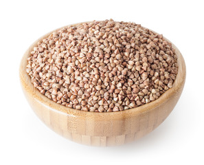 Roasted buckwheat grains in wooden bowl isolated on white background with clipping path