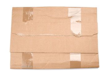 Cardboard book mailer on white background.