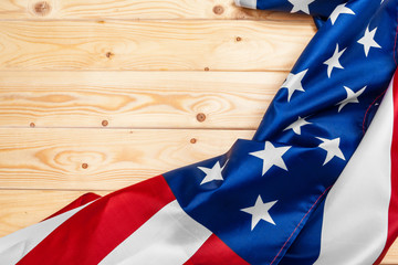 flag of the United States of America on wooden background. USA holiday of Veterans, Memorial, Independence and Labor Day.