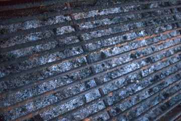 Outdoor Cooking by Grilling. Empty Charred Grill Grate Needing Cleaning. Rust and Burns Stuck on the Steel Griller. Ash and Charcoal Residue in Pit Plate