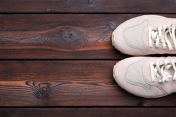 sneakers on old retro wooden background.