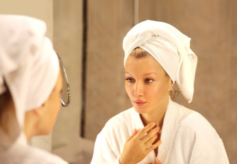 Magic anti-aging cream.Applying the cream