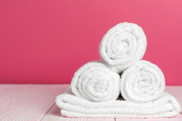 Fototapeta na wymiar Clean soft towels on wooden table