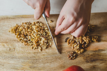 Recipe for making salad from fresh pear, pomegranate, spinach, walnut, cheese and dried cranberries...