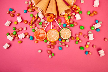 Obraz na płótnie Canvas Ice cream waffles cones with colorful candy