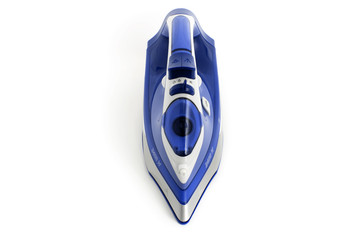 Steam iron laid on white background, blue cordless type