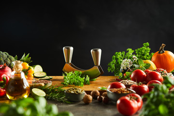 Mezzaluna knife on a board with fresh herbs
