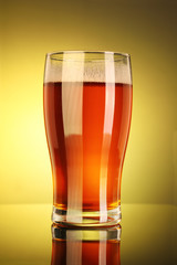 Full Beer Glass with Yellow Background