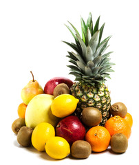 pineapple, pomegranate, lemon, kiwi, pamela and pear in a pile on a white background