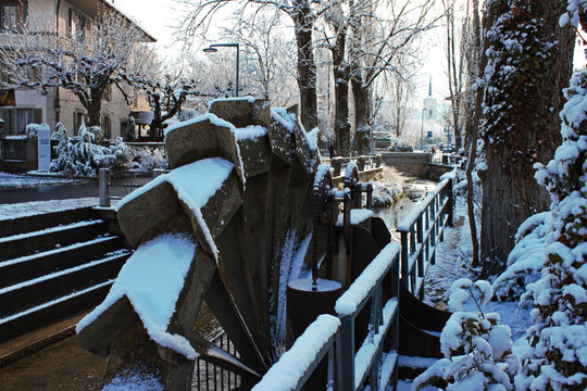 Close-up of the water mill in the Lyssbach brook at the center of Lyss, Swiss city.