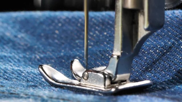 Sewing Denim Jeans with sewing machine.