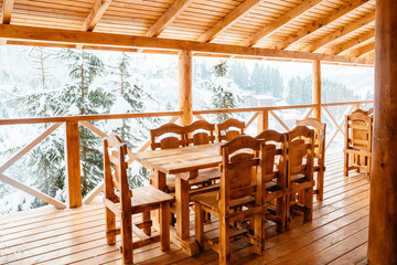 table and chairs on a wooden terrace