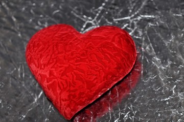 Valentine's day red heart on a silver background