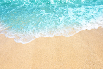 Naklejka na ściany i meble Soft wave of ocean on the sandy beach