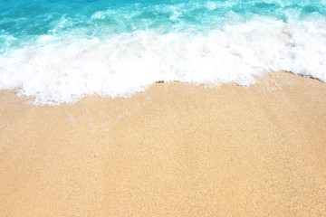 Fototapeta na wymiar Soft wave of ocean on the sandy beach
