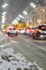 Night road in the city of lights cars traffic jams. Winter traffic in the city. vertical photo.