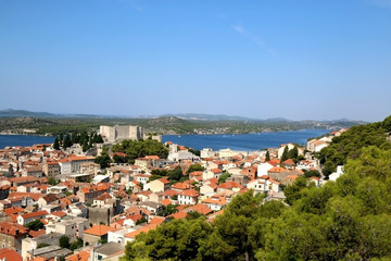 Naklejka na ściany i meble Historic city centre of Sibenik, Croatia with St. Michael's Fortress. Adriatic Sea in the background. View from the Barone Fortress.