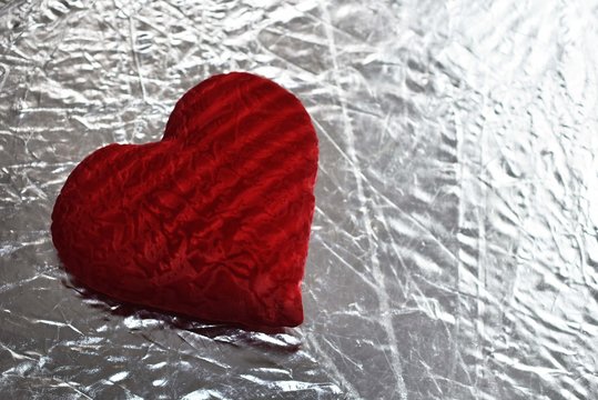 Valentine's day red heart on a silver background
