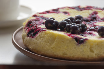 Homemade cake with berries on white background. Overhead view