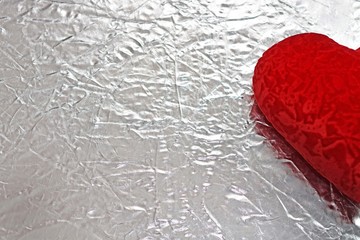 Valentine's day red heart on a silver background