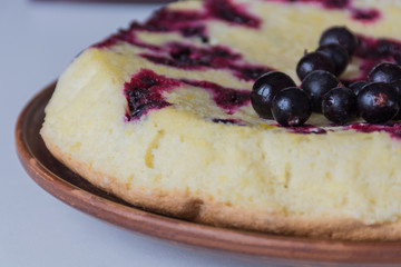 Homemade berry cake on light table. Shallow focus. Soft light