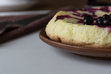 Homemade berry cake on light table. Shallow focus. Soft light