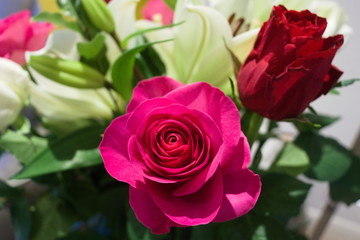 Bouquet of flowers with pink rose in foreground