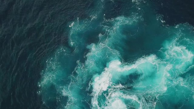 Sea surf footage from above. Cliffs and the ocean. Aerial drone shooting.