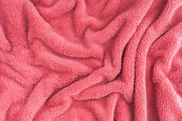Fototapeta na wymiar Close up top view of coral blanket wrinkled texture.
