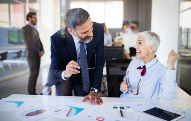 Group of successful business people happy in office