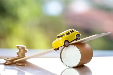 Car accident and Vehicle insurance, Debt loan concept : Miniature car on plank are falling off road...