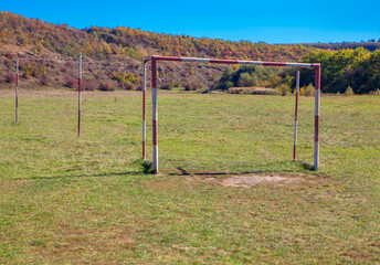 Fototapeta na wymiar abandoned football field in rural area