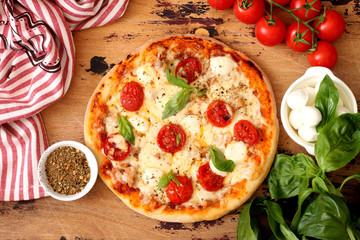 Homemade Pizza Margarita with Tomatoes, Basil and Mozzarella Cheese
