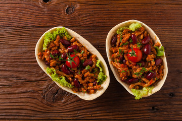 Buritos in stuff stands.