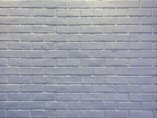 Abstract weathered modern white bricks wall background stucco in rural room . The brick work from stone tile which its was from modern paint technology.