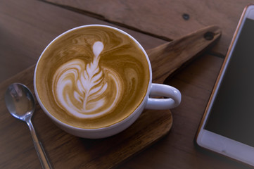 coffee latte art on wood table , coffee for idea