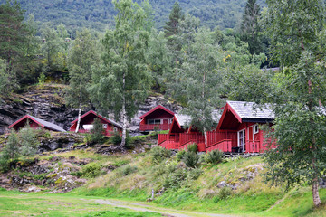 red wooden cottages in Geiranger, Norway 
