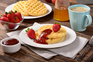 Waffles and jam on breakfast table