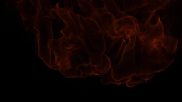 Fire ball explosion, high speed camera, isolated fire flame on black background, slow motion.