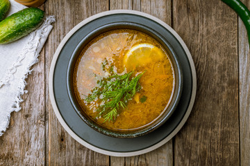 Fish soup on white plate
