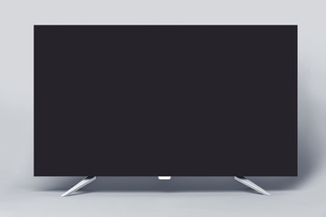 Modern TV or PC monitor on a gray background.