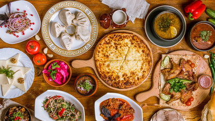 Georgian cuisine foodset from khachapuri, khinkali, pkhali, dolma, satsivi top view
