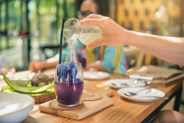 Blackberry lemonade cold with lime and ice. Healthy dessert. Fresh pink lemonade with lemon, lime and Blackberry.