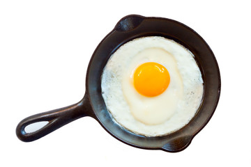 Cast iron pan with one fried egg