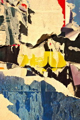 Fototapeta premium Old grunge ripped torn vintage collage street posters creased crumpled paper surface placard texture background backdrop 