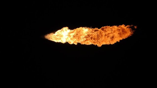 Fire ball explosion, high speed camera, isolated fire flame on black background, slow motion.