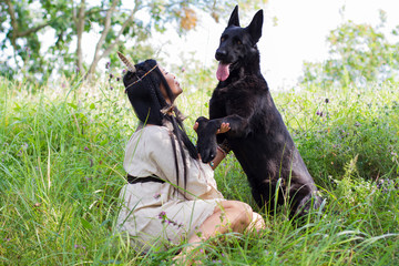woman holding dog for front paws