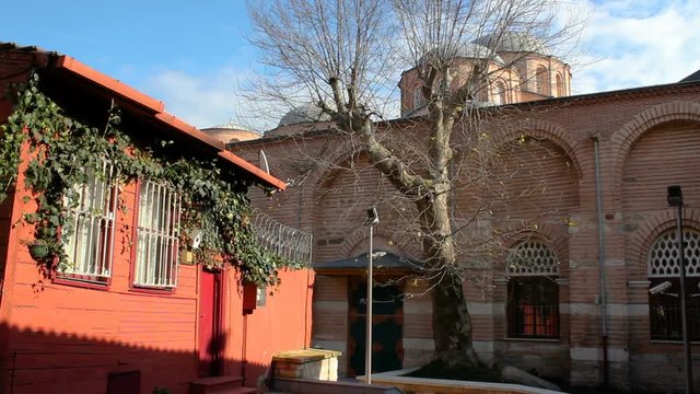 Old wooden house and Molla Zeyrek Mosque, Istanbul, Turkey