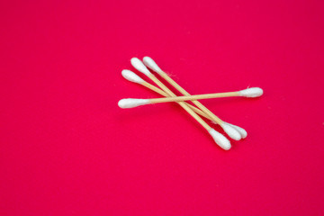 wood cotton buds isolated on purple background